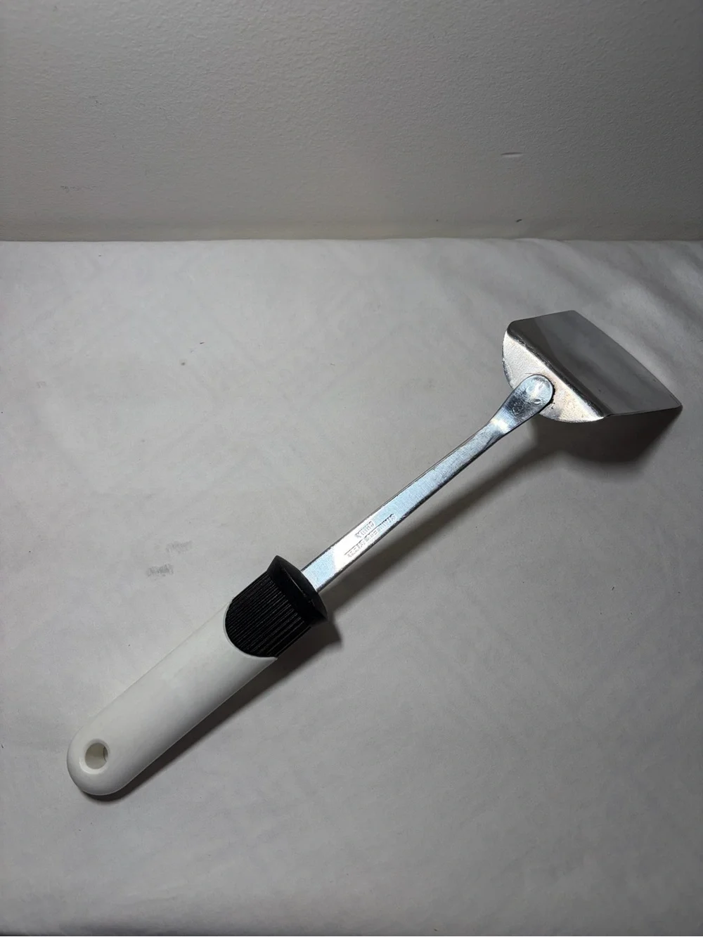 Stainless Steel Turner Spatula with White Handle and Black Grip - EKCO